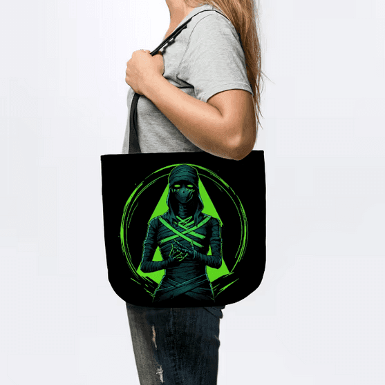 MotasTheCat black tote bag featuring a glow-in-the-dark mummy design